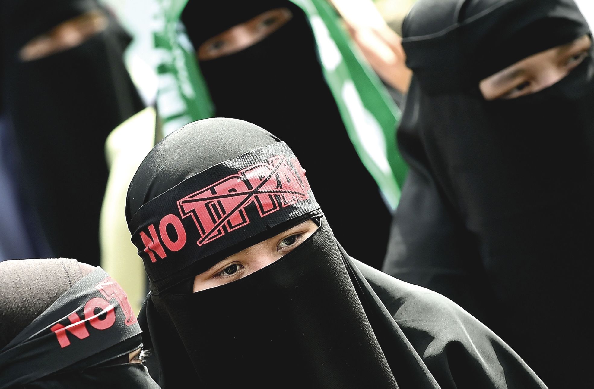 Kuala Lumpur, Malaisie, samedi 23 janvier. Des opposants à l'accord ont manifesté dans la capitale. Parmi eux, des membres du Parti islamique pan-malaisien.